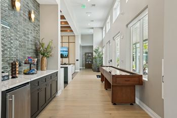 A long hallway with a counter on the left and a door at the end at The Junction at Rockledge Apartments, Rockledge 32955